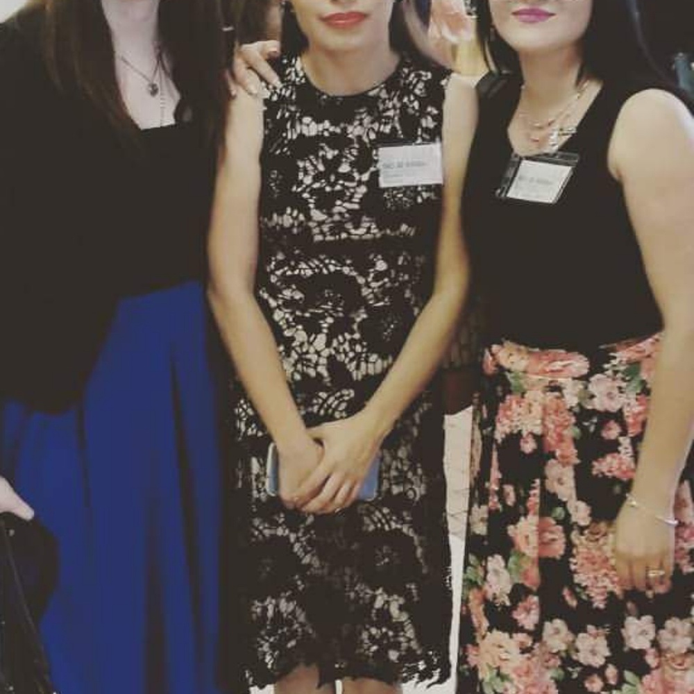 The dress that is in the middle of all 3 dresses.